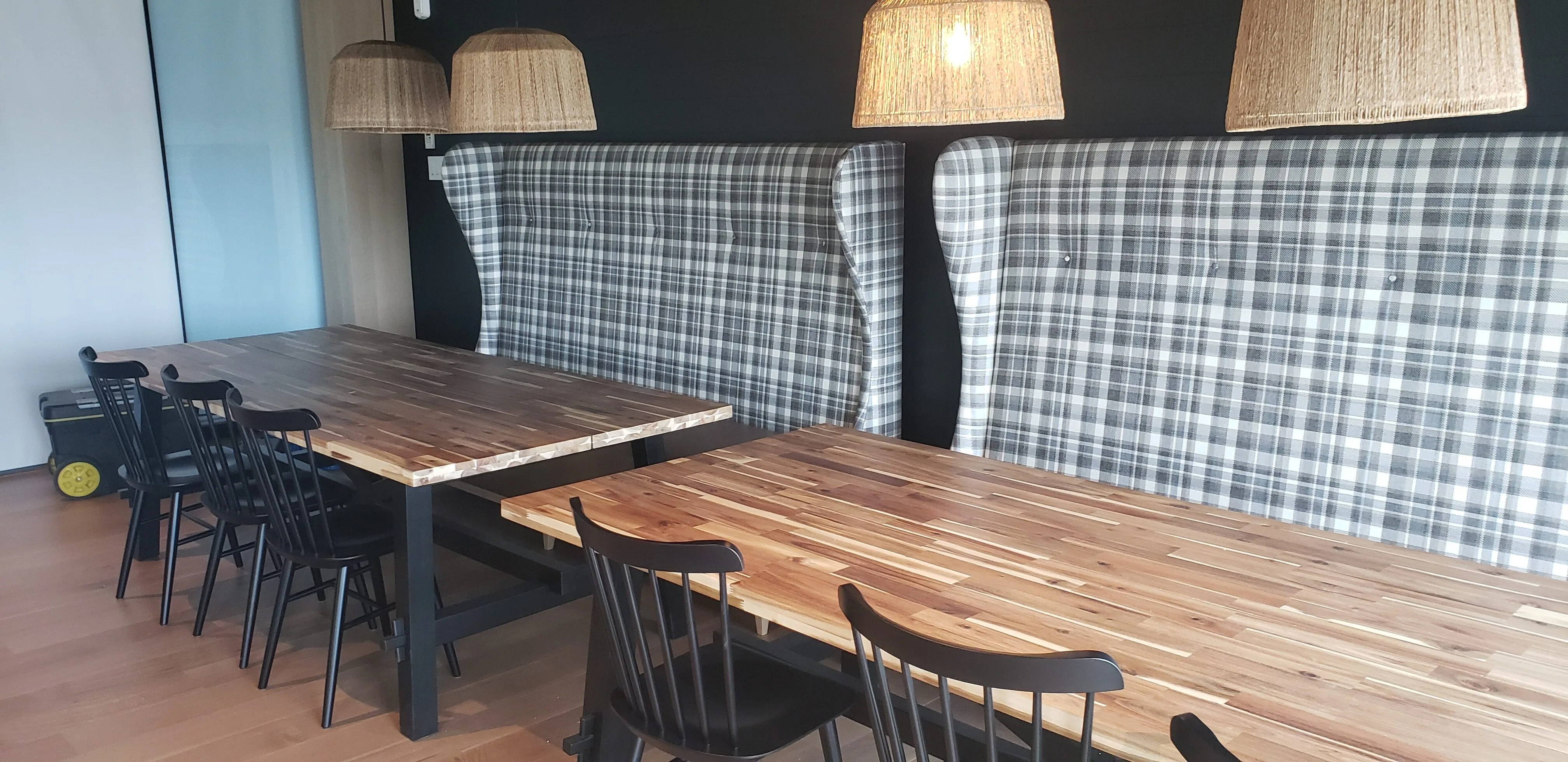 Upholstered restaurant banquettes and custom tables built by Meubles Ciano