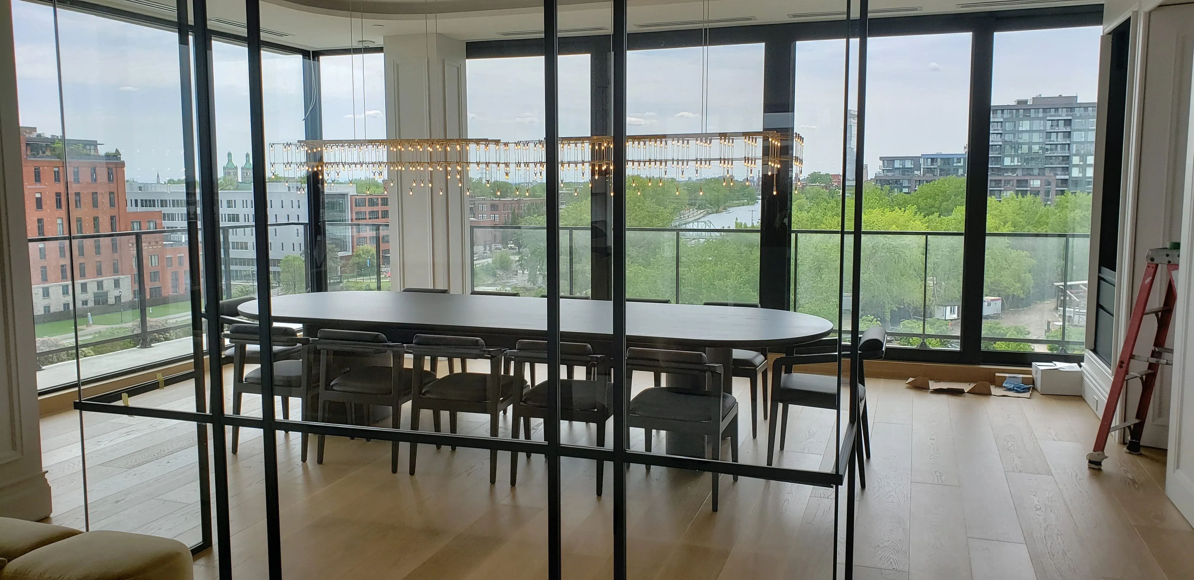 Custom solid-wood dining table in a Montréal penthouse by Meubles Ciano
