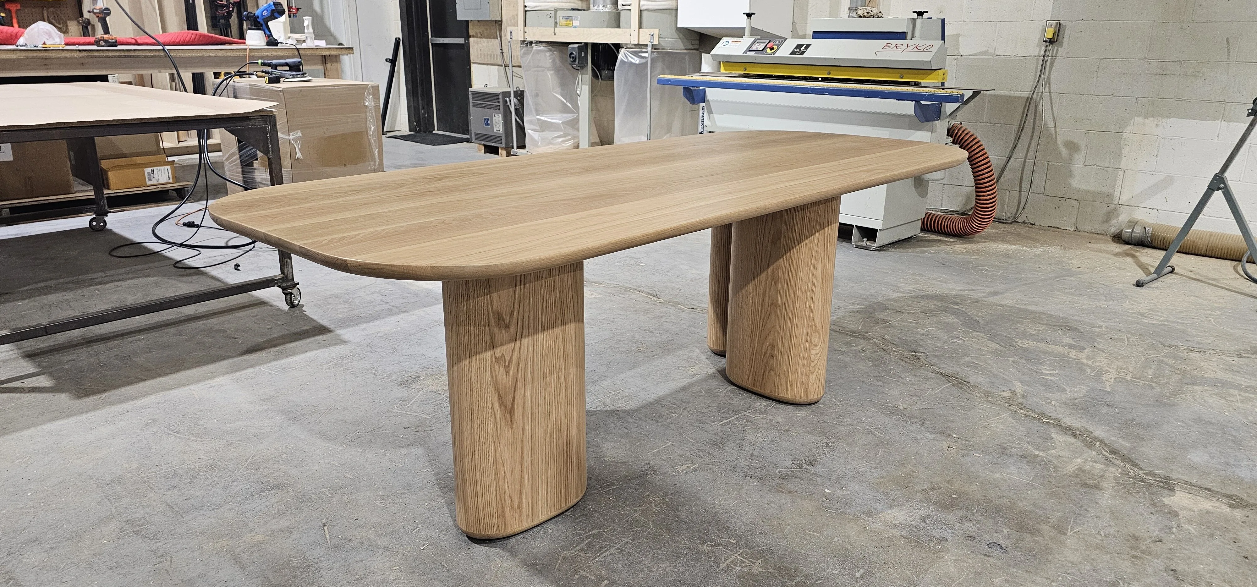 Solid white-oak dining table built in the Meubles Ciano workshop