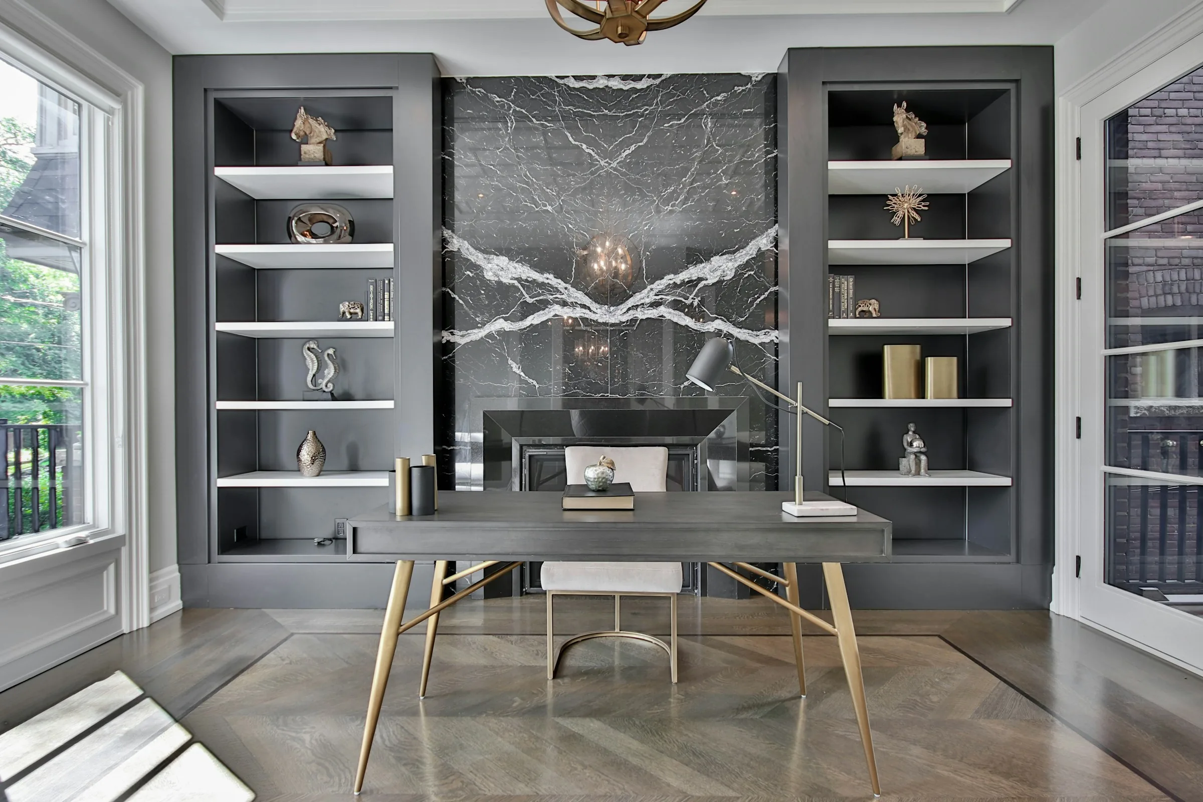 Built-in study in grey with a marble feature panel and desk