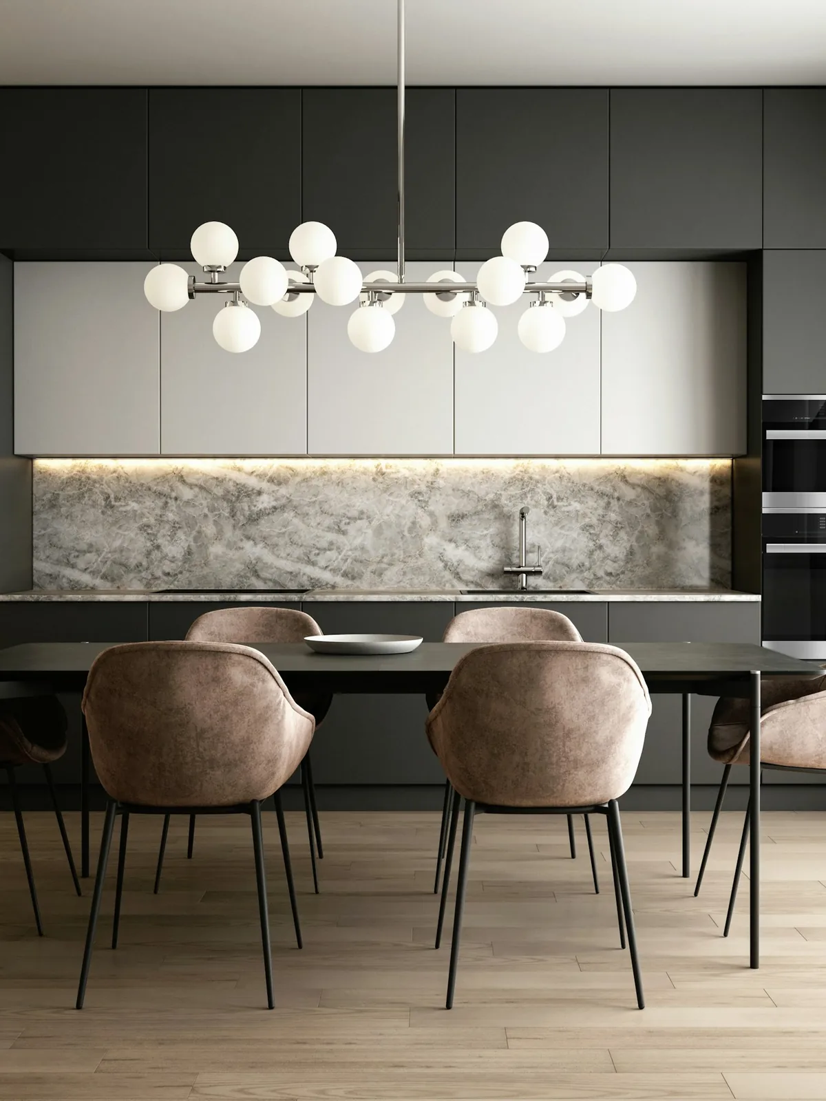 Dark floor-to-ceiling kitchen cabinetry with a marble backsplash and integrated ovens